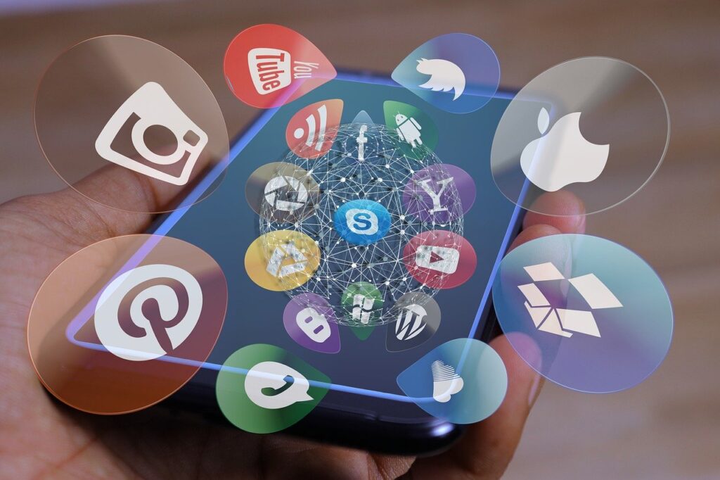 Smartphone displaying social media app icons representing digital marketing and social media marketing